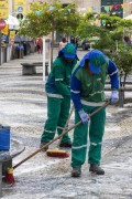 Garis from the Salvador Urban Cleaning Company (LIMPURB) sweeping the floor of Terreiro de Jesus square - also known as 15 de Novembro Square - Salvador city - Bahia state (BA) - Brazil