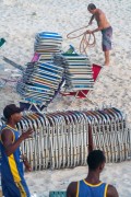 Workers at Arpoador Beach organizing beach chairs for rent - Rio de Janeiro city - Rio de Janeiro state (RJ) - Brazil