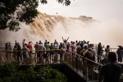 Tourists watching the Iguassu Waterfalls during the second biggest flood in history - Iguassu National Park  - Foz do Iguacu city - Parana state (PR) - Brazil