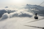 Cable car making the crossing between the Urca Mountain and Sugarloaf over the clouds - Rio de Janeiro city - Rio de Janeiro state (RJ) - Brazil