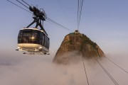Cable car making the crossing between the Urca Mountain and Sugarloaf over the clouds - Rio de Janeiro city - Rio de Janeiro state (RJ) - Brazil