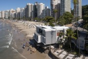 Picture taken with drone of the Casa da Pedra - built on rocks between the beaches of Pitangueiras and Asturias - Guaruja city - Sao Paulo state (SP) - Brazil
