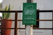 Sign announcing the end of combustion vehicles on the island and the reduction of gas emissions by 2030 - Fernando de Noronha Environmental Protection Area - Fernando de Noronha city - Pernambuco state (PE) - Brazil
