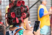 Woman in costume with curlers in her hair - Largo de Sao Francisco de Paula during Fogo e Paixao carnival street troup parade  - Rio de Janeiro city - Rio de Janeiro state (RJ) - Brazil