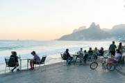 People at tables of Alalao Kiosk with Two Brothers and Rock of Gavea in the background - Rio de Janeiro city - Rio de Janeiro state (RJ) - Brazil