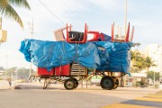 Detail of cargo trolley - man carrying a cart - with beach chairs - Copacabana Beach waterfront - Rio de Janeiro city - Rio de Janeiro state (RJ) - Brazil