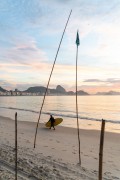 Man with stand up paddle board at dawn on Copacabana Beach - Rio de Janeiro city - Rio de Janeiro state (RJ) - Brazil