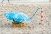 Sun umbrella protecting a water pump on Arpoador Beach - Rio de Janeiro city - Rio de Janeiro state (RJ) - Brazil