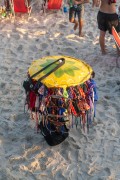 Improvised sun umbrella as a display for selling dresses on Arpoador Beach - Rio de Janeiro city - Rio de Janeiro state (RJ) - Brazil