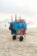 Detail of cargo trolley - man carrying a cart - with beach chairs - Copacabana Beach - Rio de Janeiro city - Rio de Janeiro state (RJ) - Brazil