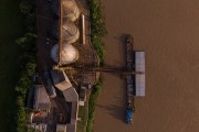 Picture taken with drone of a ferry transporting cargo docked at the port of Madeira River - Porto Velho city - Rondonia state (RO) - Brazil