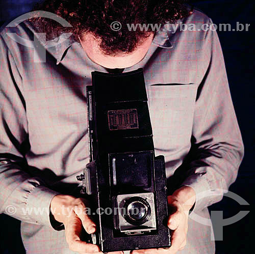  Fotógrafo com câmara fotográfica 