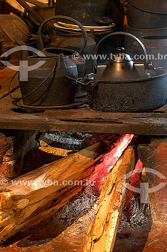  Wood oven with iron pans above it 