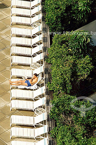  Leisure - Man reading in beach chair 