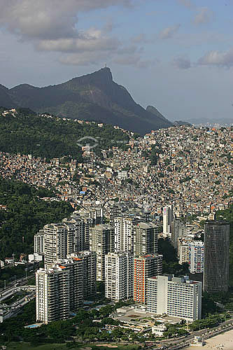  São Conrado neighborhood buildings in the foreground, Rocinha slum in the center and Christ the Redeemer in the background - Rio de Janeiro city - Rio de Janeiro state - Brazil  - Rio de Janeiro city - Rio de Janeiro state - Brazil