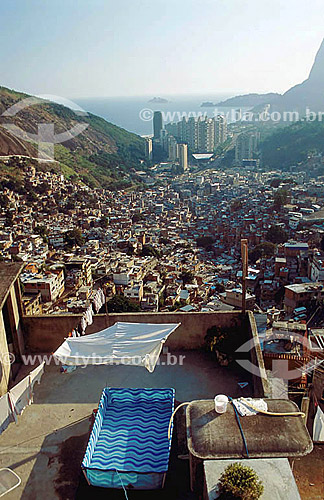 Plastic swimming pool at Rocinha Slum with Sao Conrado buildings in the background - Rio de Janeiro city - Rio de Janeiro state - Brazil 