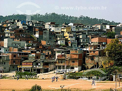  Boys playing football in a slum 