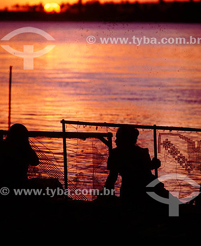  Craftwork - silhouette of craftsmen by sunset  - Brazil