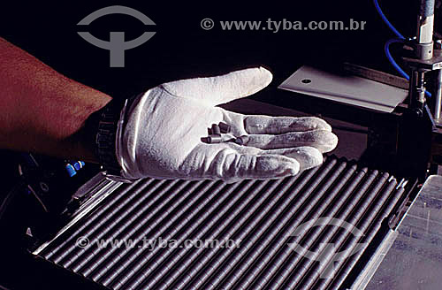  Industrial - Detail of hand with glove holding uranium  - Brazil