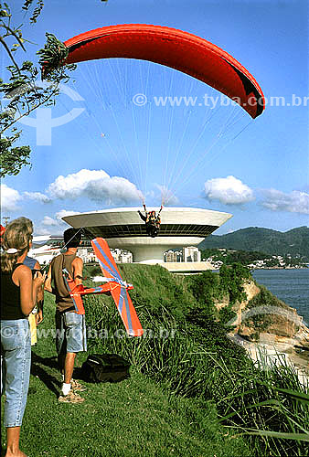  Paragliding in Niteroi city, with the MAC (Museum of Contemporary Art of Niteroi city)* in the background - Rio de Janeiro state - Brazil  * Project by the architect Oscar Niemeyer, the MAC was constructed at the Mirante da Boa Viagem Overlook. 