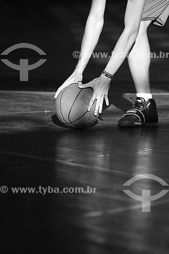  Person picking up basketball 