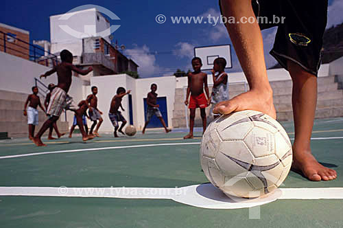  Boys playing football at a sports square - Vidigal Slum - Rio de Janeiro city - Rio de Janeiro state - Brazil 
