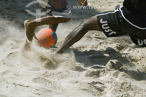  People playing soccer in the beach - Salvador city - Bahia state - Brazil 