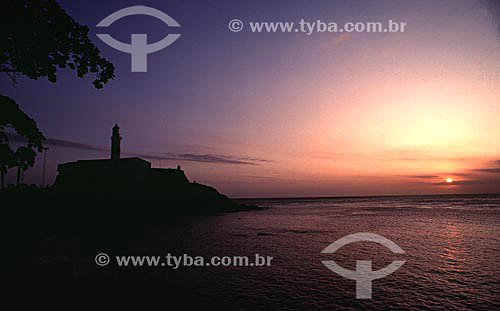  The silhouette of Farol da Barra (Barra Lighthouse) at sunset - Salvador city* - Bahia state - Brazil  *The city is a UNESCO World Heritage Site since 06-12-1985. 