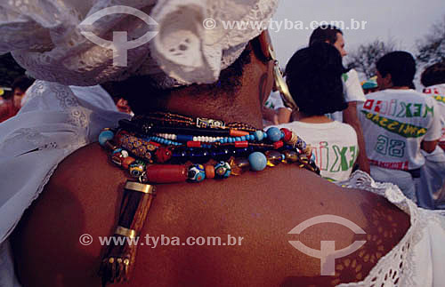  Baiana (typical woman from Bahia) with an amulet and several necklaces on the neck - Salvador city - Bahia state - Brazil 