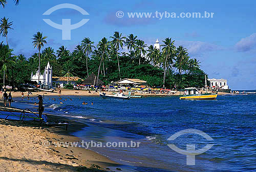  People at the beach with boats at the sea - Forte Beach - Mata de Sao Joao city - Bahia state - November 2001 