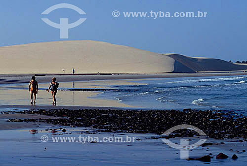  A couple walking on Jericoacoara Beach - Ceara state - Brazil 