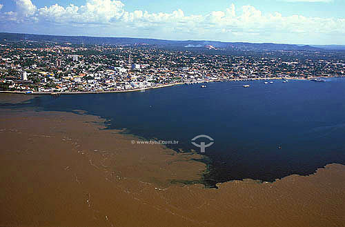  Aerial view of the meeting of waters of Tapajos (blue) and Amazon Rivers near Santarem town - Para state - Brazil 
