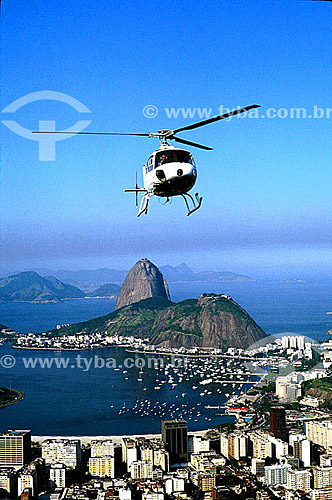  Sugar Loaf Mountain* and Botafogo Cove with a helicopter in the foreground - Rio de Janeiro city - Rio de Janeiro state - Brazil  * Commonly called Sugar Loaf Mountain, the entire rock formation also includes Urca Mountain and Sugar Loaf itself (the 