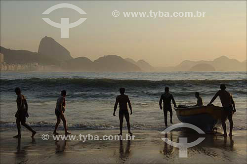  Copacabana Beach with Fishing boats and fishermen in the foreground and Suggar Loaf* in the background - Rio de Janeiro city - Rio de Janeiro state - Brazil - October 2006  *Commonly called Sugar Loaf Mountain, the entire rock formation also include 