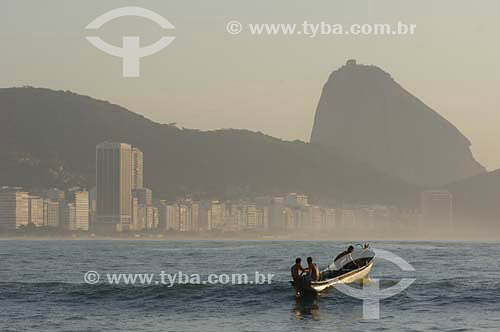  Fishermen entering in the sea - Fishing colony at Copacabana Beach - Suggar Loaf in the background - Rio de Janeiro city - Rio de Janeiro state - Brazil - October 2006 