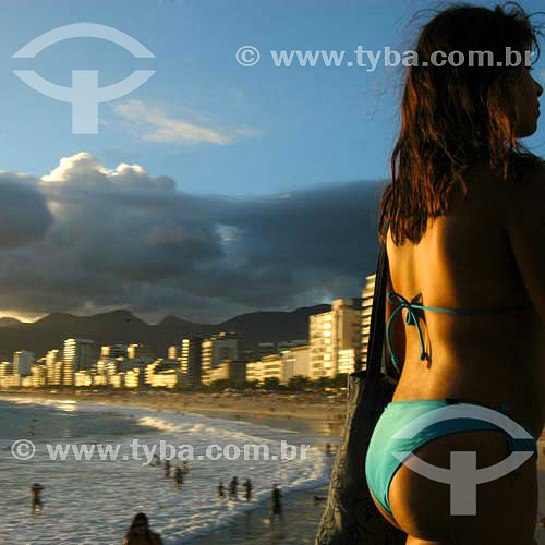  People at Ipanema Beach with buildings in the background and a woman wearing a bikini in the foregroung - Rio de Janeiro city - Rio de Janeiro state - Brazil 