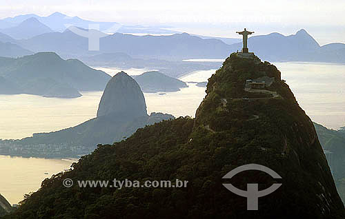  Aerial view of Cristo Redentor (Christ the Redeemer) with Sugar Loaf Mountain to the left, and the city of Niteroi in the background - Rio de Janeiro city - Rio de Janeiro state - Brazil  