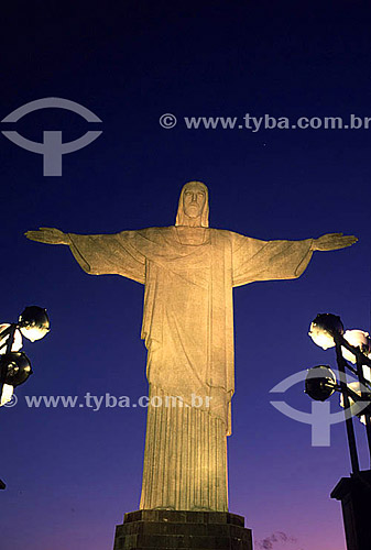  The brightly illuminated Cristo Redentor (Christ the Redeemer) at twilight - Rio de Janeiro city - Rio de Janeiro state - Brazil 