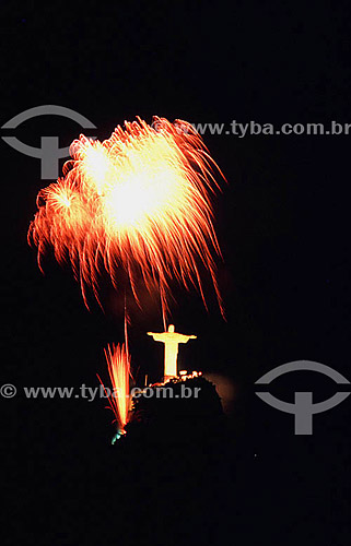  Fireworks bursting above the brightly illuminated Cristo Redentor (Christ the Redeemer) at twilight - Rio de Janeiro city - Rio de Janeiro state - Brazil 