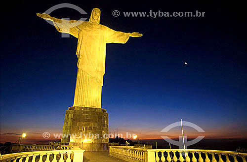  The brightly illuminated Cristo Redentor (Christ the Redeemer) at twilight - Rio de Janeiro city - Rio de Janeiro state - Brazil 