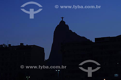  Silhouette of Cristo Redentor (Christ the Redeemer) as seen from the Botafogo neighborhood- Rio de Janeiro city - Rio de Janeiro state - Brazil 