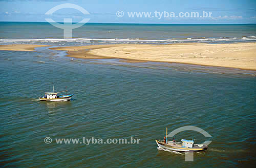  Fishing boats at the sea next to a sand bank at Barra de Atafona - Campos city - Rio de Janeiro state - Brazil 