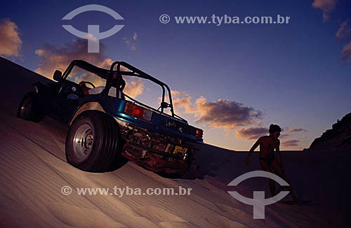  Men driving a jeep in the Genipabu dunes - Natal city - Rio Grande do Norte state - Brazil 