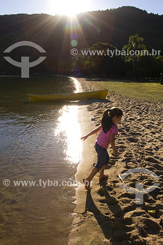  Girl playing in beach at costa da lagoa - Lagoa da Conceição lagoon - Florianopolis city - Santa Catarina state - Brazil 