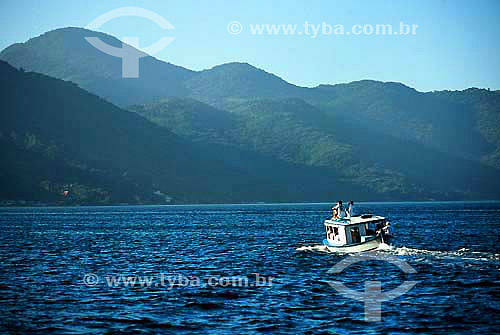  Fishing boat and mountains in the background at Lagoa coast - Florianopolis city - Santa Catarina state - Brazil - July 2005 