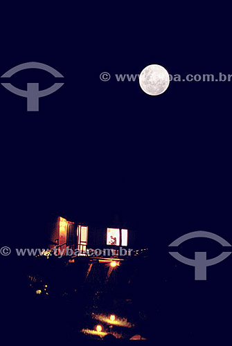  Couple kissing at the window under the full moon - Ilha do Papagaio (Parrot Island) - Florianopolis city - Santa Catarina state - Brazil 