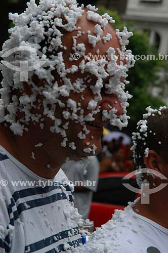  Reveller covered by foam during the Carnival street party - 