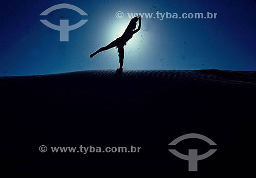  Silhouette of women making exercise 