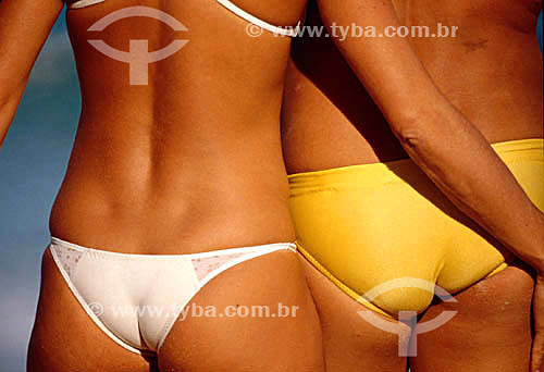  Detail of couple- Woman wearing a tanga bikini and man bathsuit 