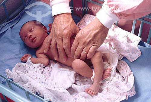 Woman`s hands changing baby `s diaper 